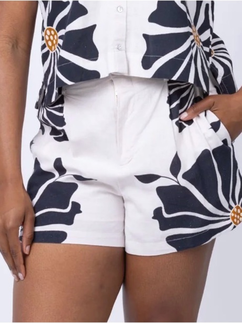 Cleobella White High-Waist Shorts with Navy Floral Print